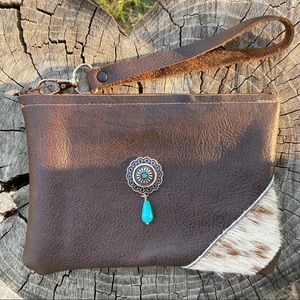 Leather cowhide wristlet with turquoise concho